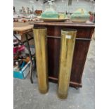 A pair of brass shell cases 79cm tall.