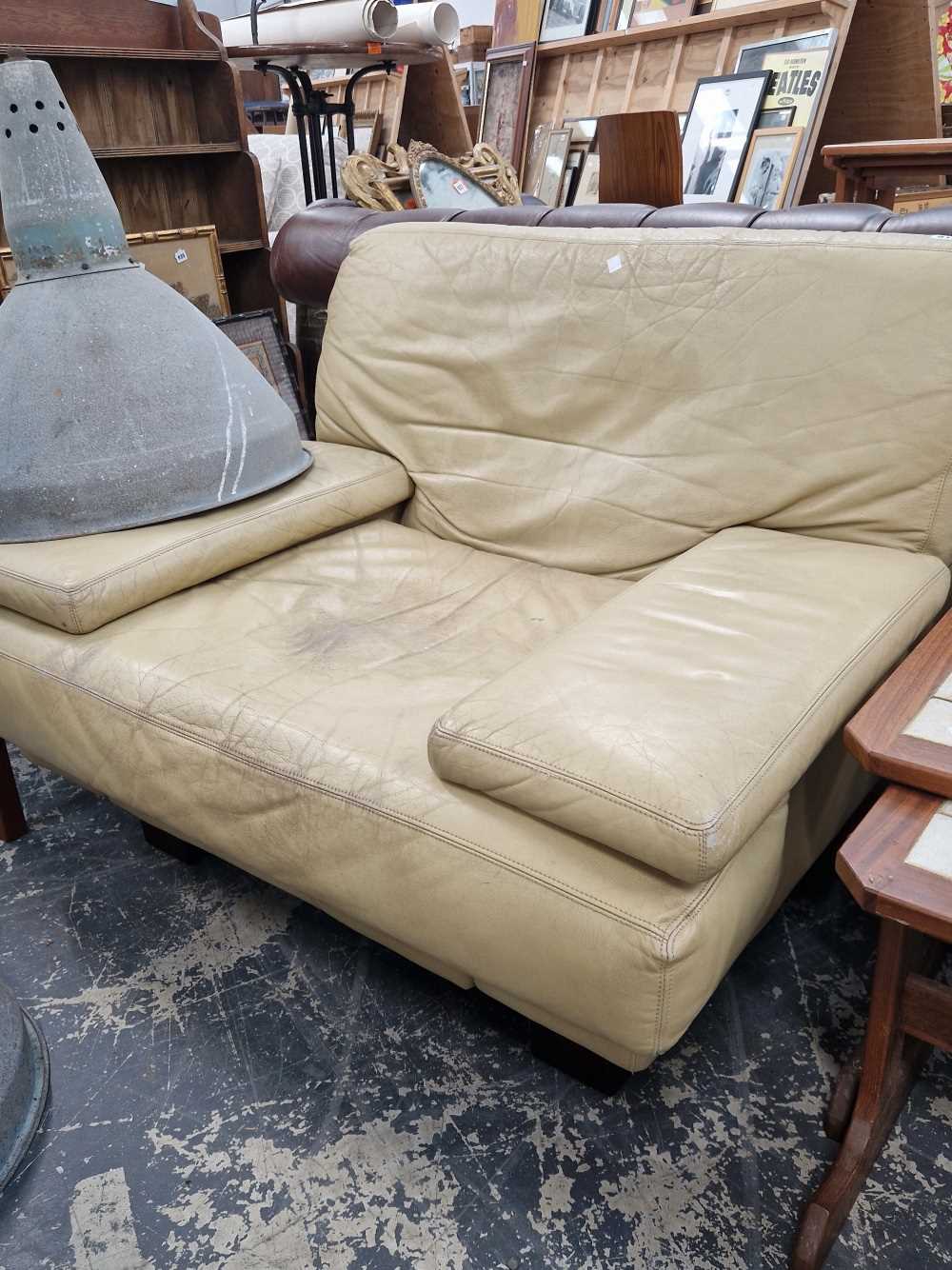 A mid-century leather upholstered armchair.