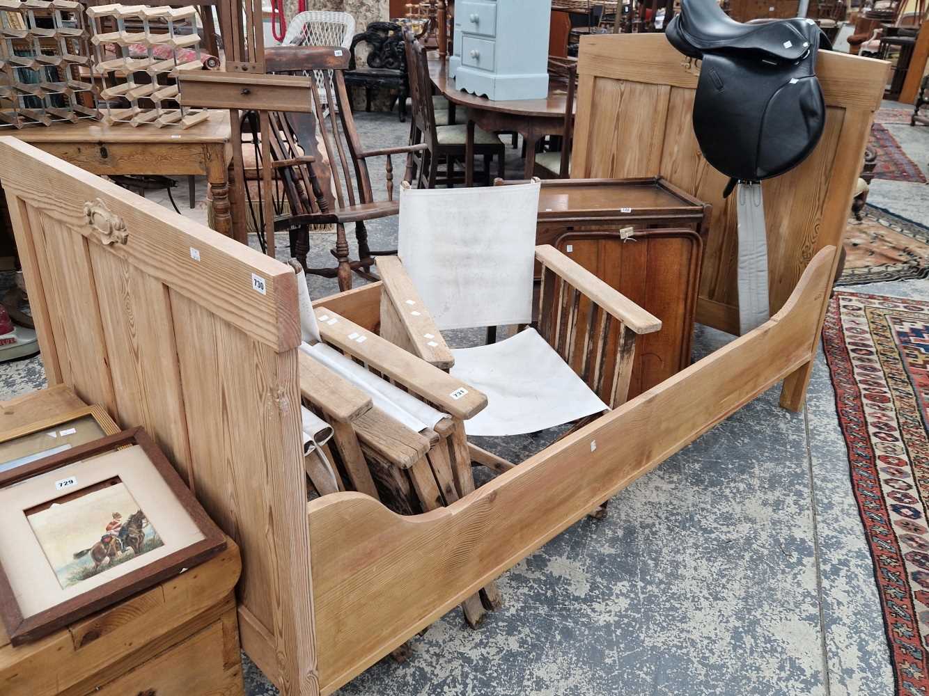 A continenal pine single sleigh bed.