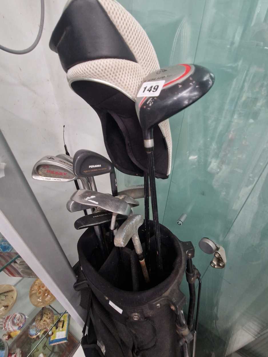 A bag of Howson, Trident, Sootia and other golf clubs