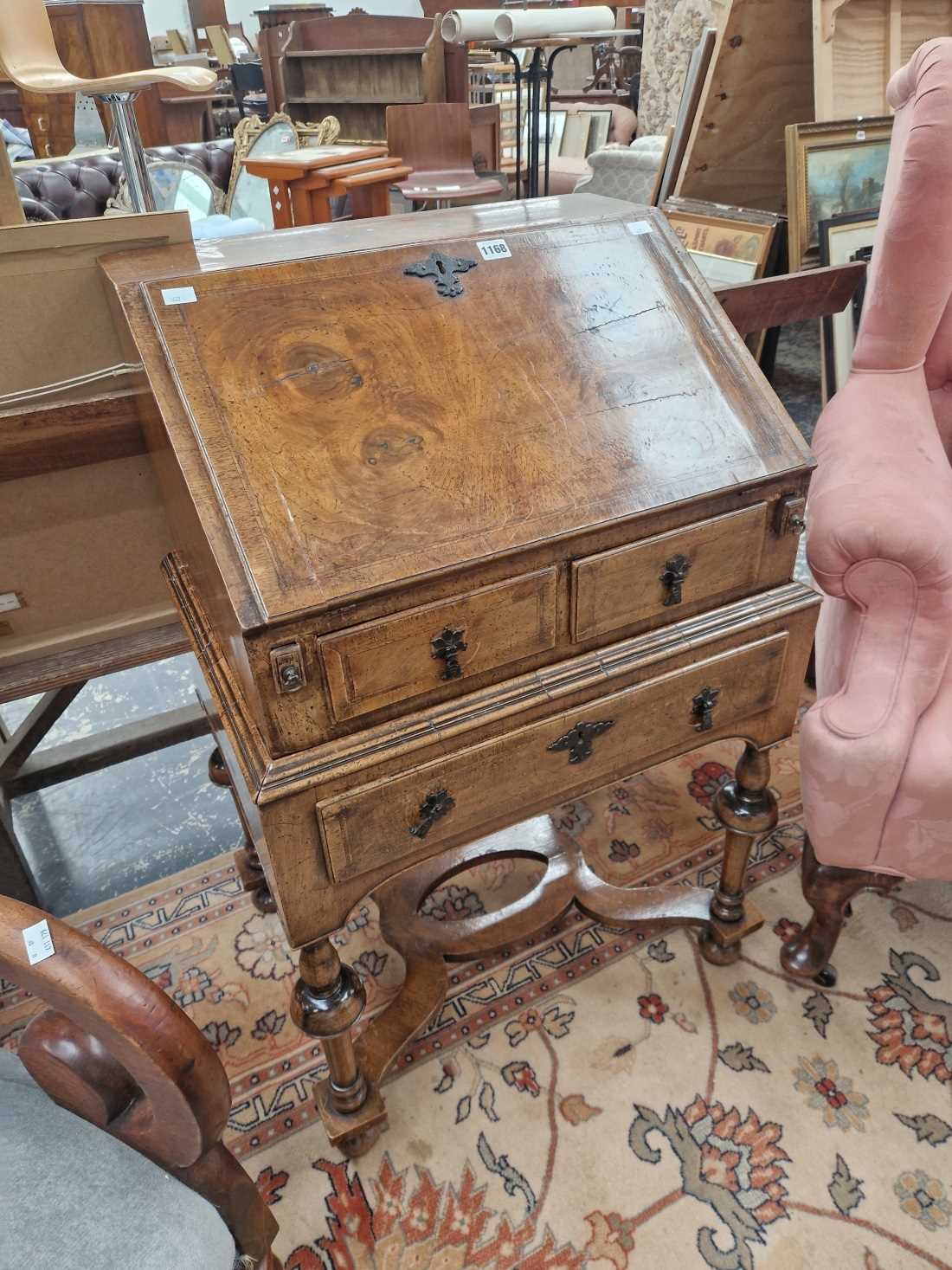 A 17th century style walnut bureau on stand.