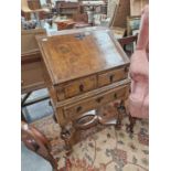 A 17th century style walnut bureau on stand.