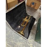 A vintage cased trumpet