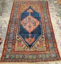 AN ANTIQUE PERSIAN SERAB RUG 182 x 117 cm.