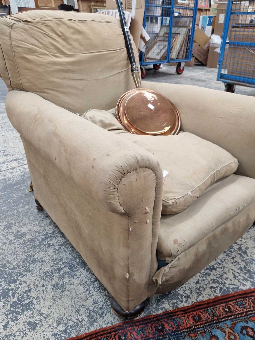 A early 20th century deep seat club arm chair, with feather stuffed back and loose seat cushion.