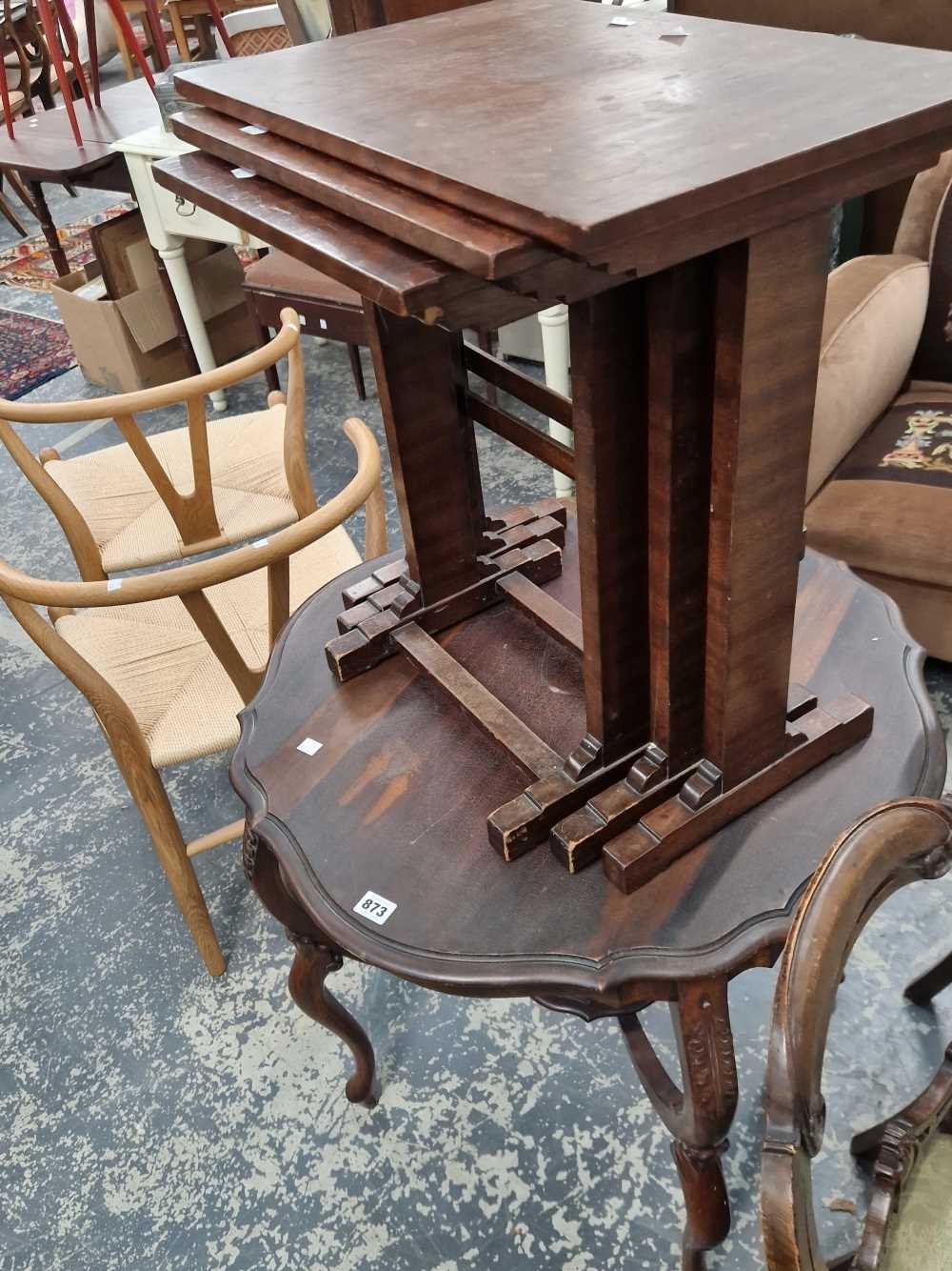 A mahogany nest of tables and a shaped centre table.