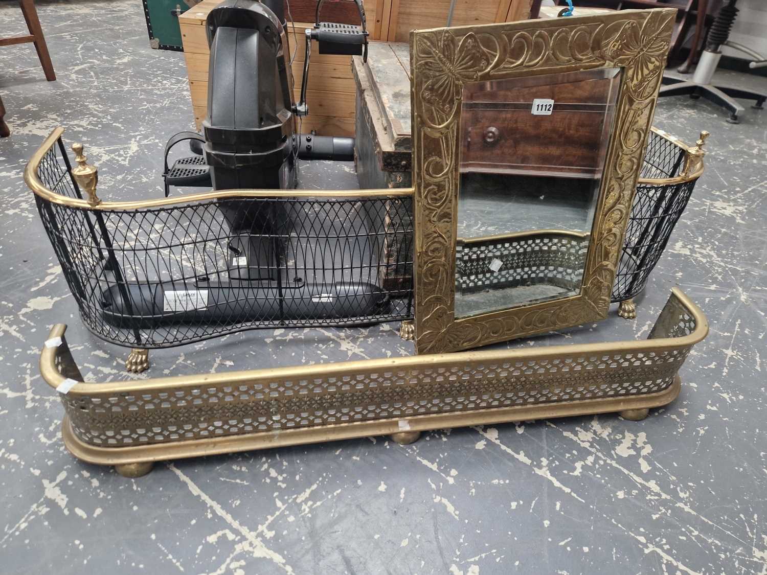 Arts and Crafts style brass wall mirror and two fire kerbs