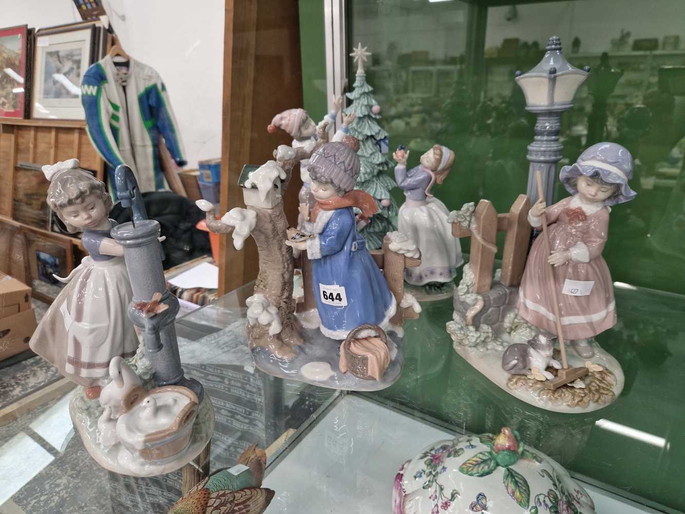 Four large Lladro figure groups.