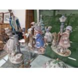 Four large Lladro figure groups.