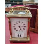 A vintage brass cased carriage clock with leather outer travelling case.