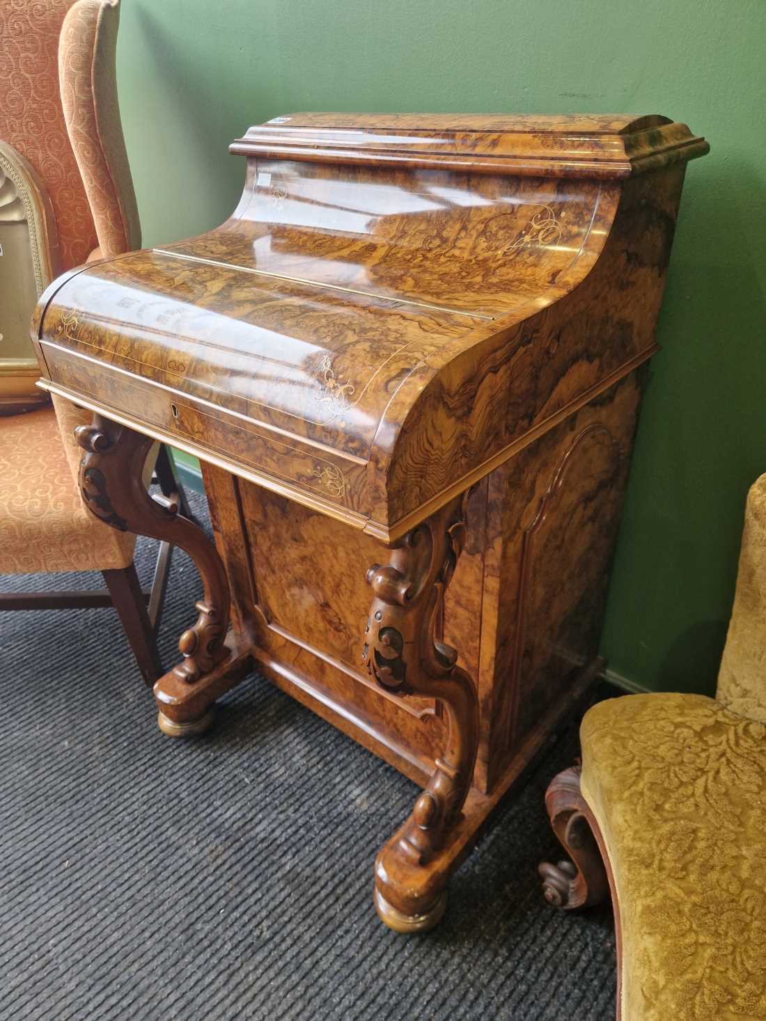 A fine Victorian burr walnut piano top pop up Davenport desk. Slight bubbling to the veneer on the