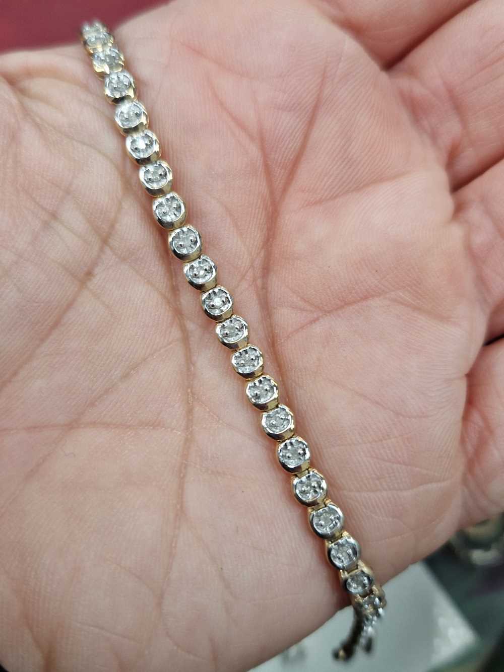 A 9ct stamped diamond set line tennis bracelet, diamond stated weight 0.50cts, together with a 9ct - Bild 2 aus 3