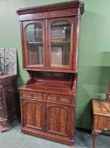 A Victorian mahogany bookcase cabinet.