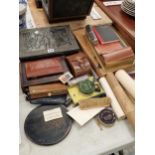 Desk top and writing materials, a box of geometry instruments, 1930s award scrolls, etc.