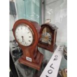 Two mantel timepieces, one in a mahogany balloon shaped case