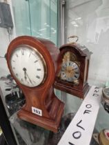 Two mantel timepieces, one in a mahogany balloon shaped case