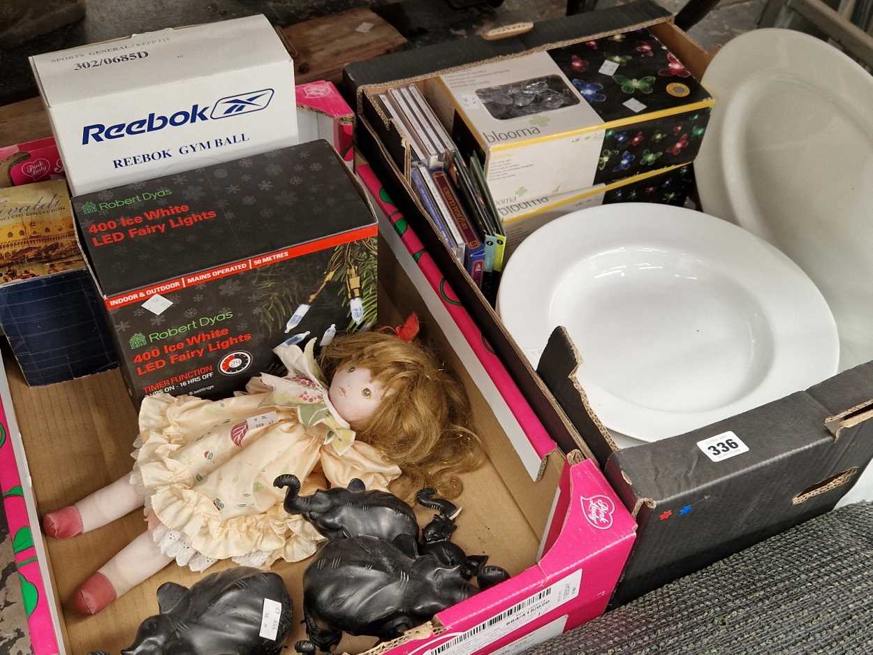 boxed LED strings of lights, CDs, white dinner wares, a doll, etc.