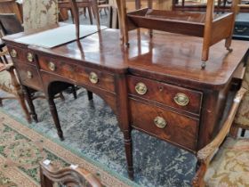 A George III mahogany break front side board.