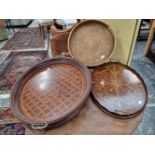 An Edwardian inlaid wine tray, a large inlaid walnut and gilt brass mounted deep tray and a rattan