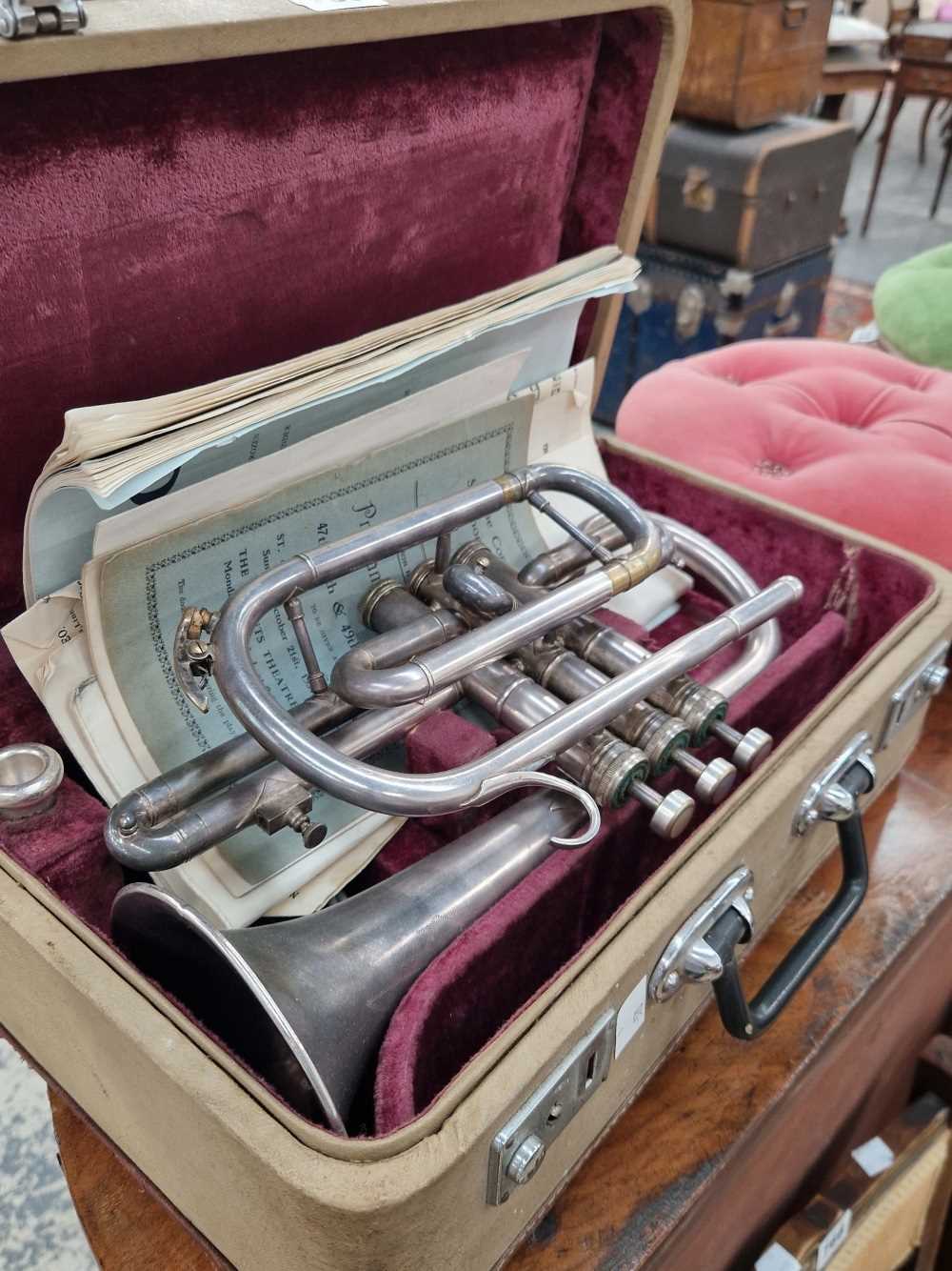 A silver plated cornet cased.