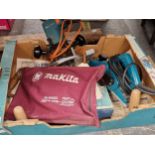 A Makita sanding tool, a Black & Decker micro adjustment saw, a two handled pit saw,