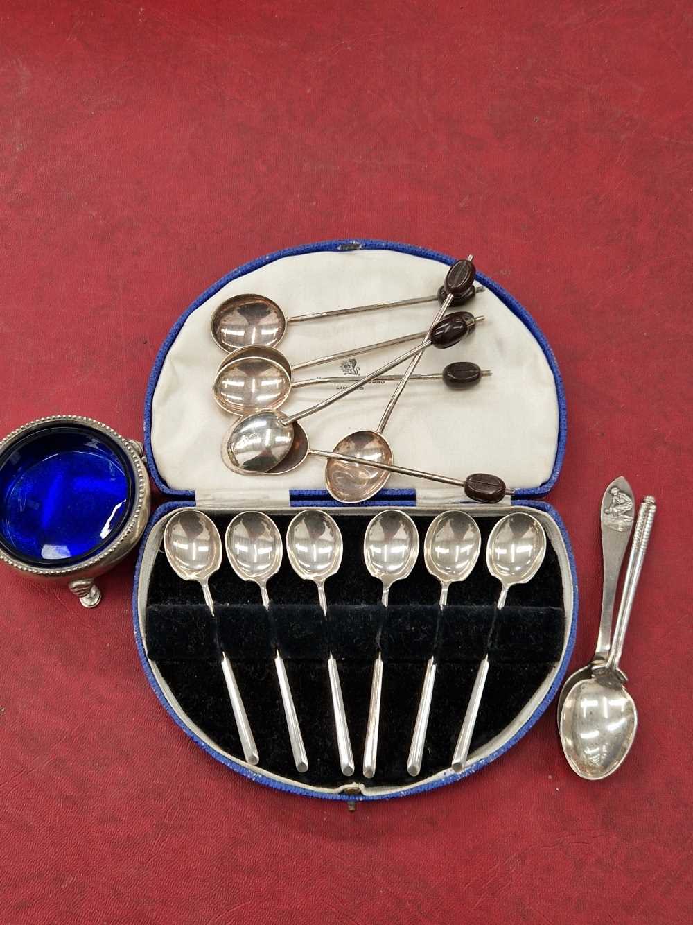 Hallmarked silver to include a set of six Henry Birks coffee spoons, a further set of six, two other