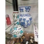 An William De Morgan Iznik bottle vase together a porcelain vase decorated with stems of blue