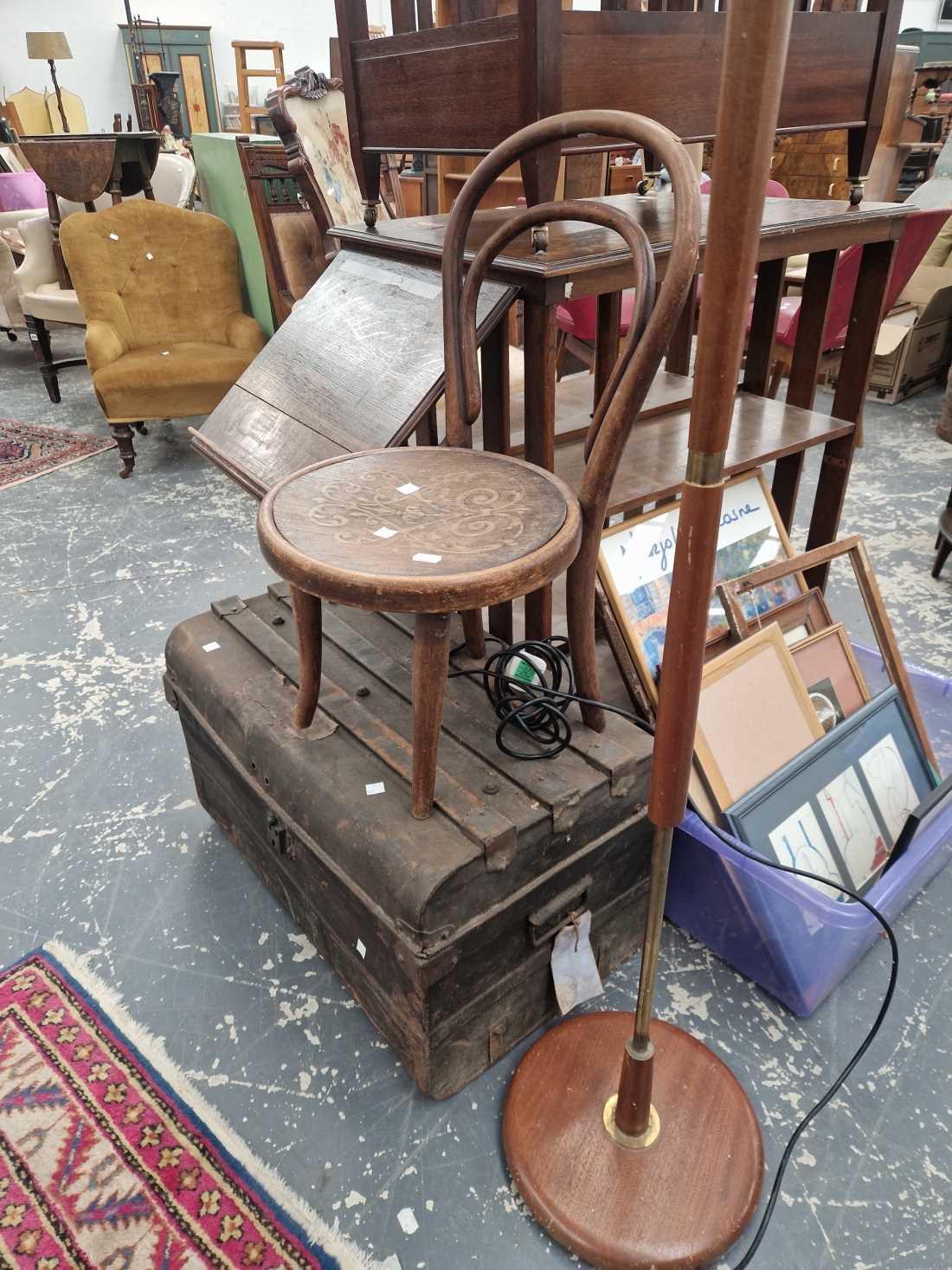 A retro standard lamp, a childs chair, a tin trunk and a wall mirror