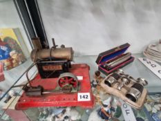 A Mamod live steam engine, a pair of opera glasses and a Hohner harmonica