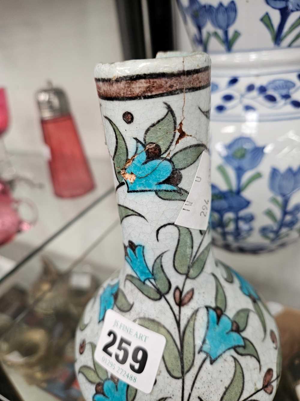 An William De Morgan Iznik bottle vase together a porcelain vase decorated with stems of blue - Image 7 of 15