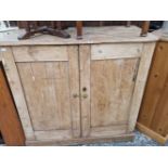 A Victorian pine two door cabinet and a kitchen chair