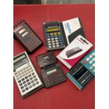 A collection of six vintage calculators to include Casio personal mini, Casio scientific, Canon card