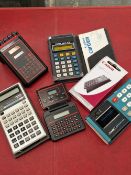 A collection of six vintage calculators to include Casio personal mini, Casio scientific, Canon card