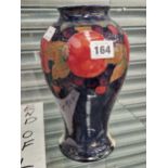 A Moorcroft pomegranate pattern baluster vase H 25cm