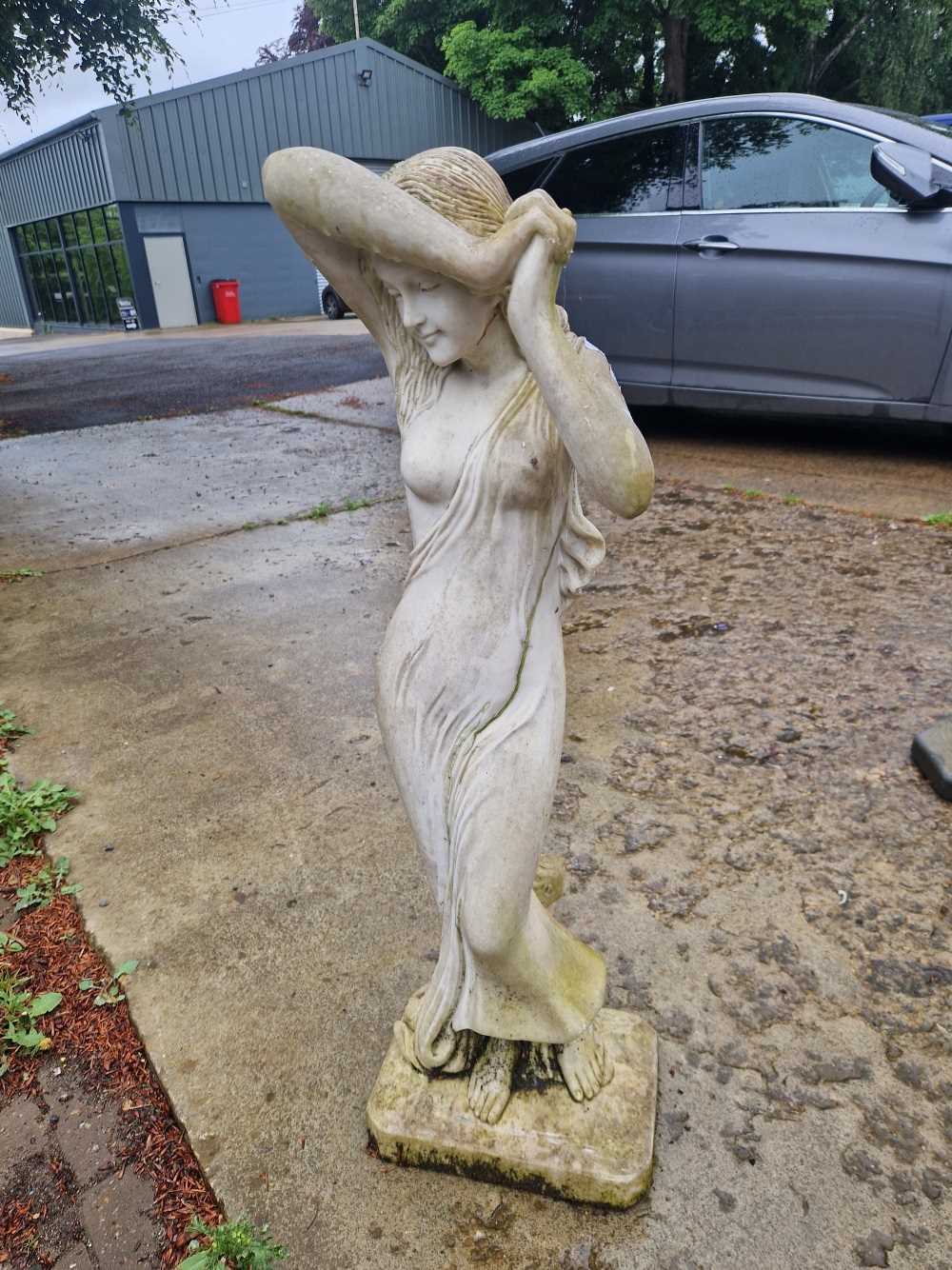 A garden statue of a maiden