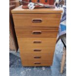 A pair of retro teak small six drawer chests.