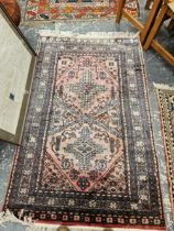 A PERSIAN MAT, TOGETHER WITH AN ORIENTAL RUG OF CAUCASIAN DESIGN 162 x 102 cm