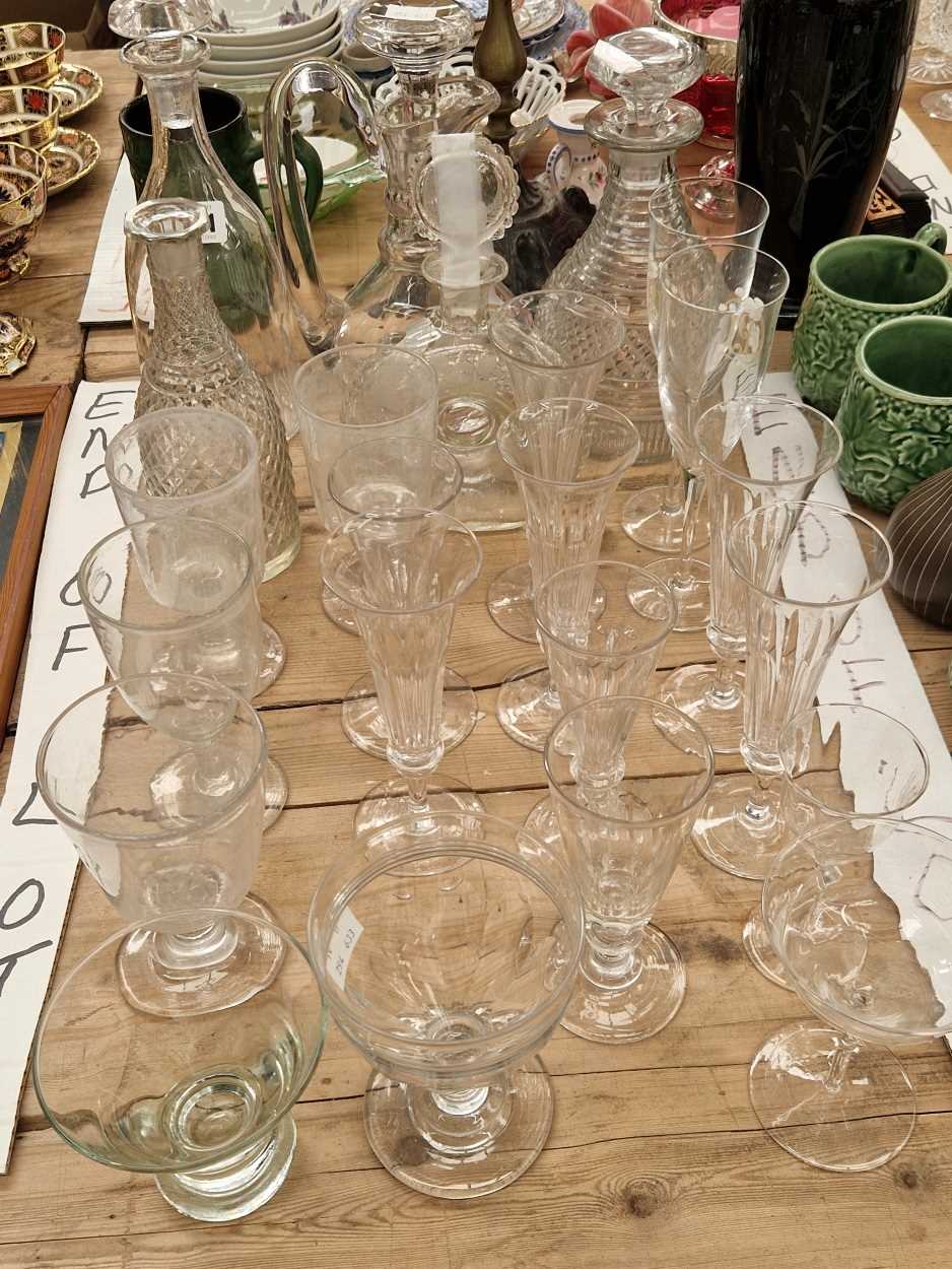 Decanters, a claret jug, champagne flutes, a rummer and other drinking glass