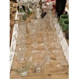 Decanters, a claret jug, champagne flutes, a rummer and other drinking glass