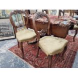 A set of four Victorian balloon back chairs.