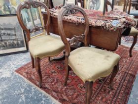 A set of four Victorian balloon back chairs.