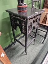 An Arts and Crafts black painted occasional table.