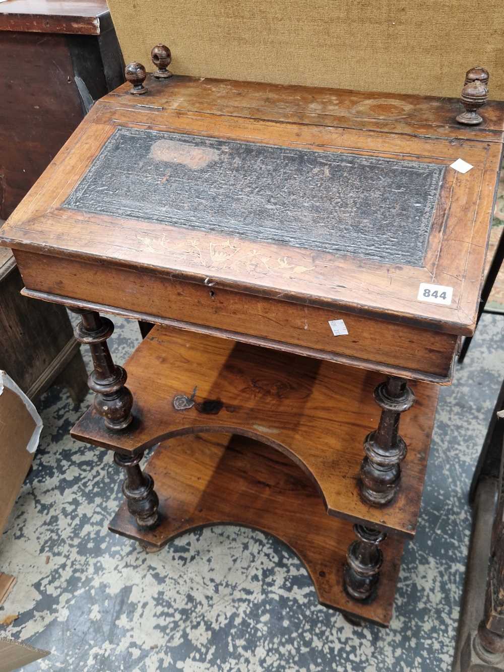 A small walnut Davenport desk.