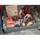 Boxed Lledo die cast toys, African souvenir figures, a travel clock, boxed Tetley tea bag figures