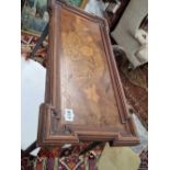 An occasional table incorporating an inlaid Victorian panel.