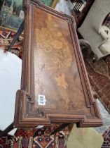 An occasional table incorporating an inlaid Victorian panel.