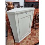 A Georgian painted corner cabinet.