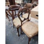 Four Victorian balloon back chairs.