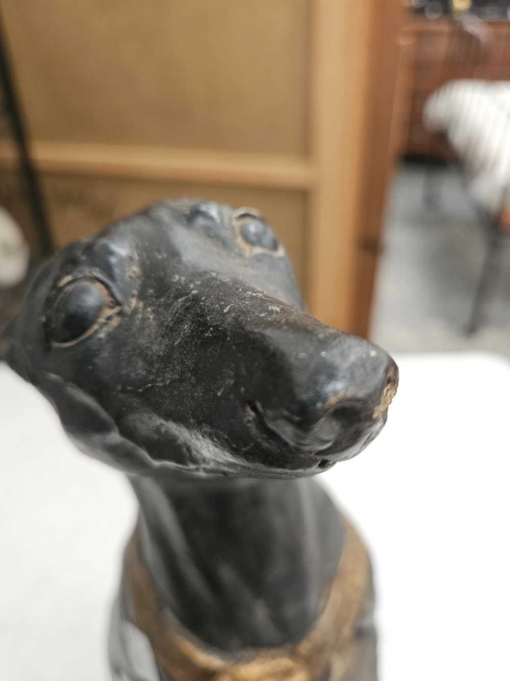 An iron bootscraper together with a plaster seated greyhound figure Chip to base of greyhound - Image 3 of 17