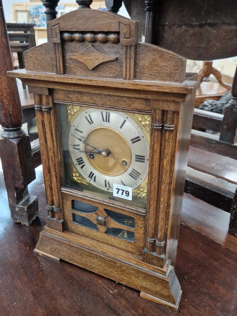 Antique oak mantle clock.